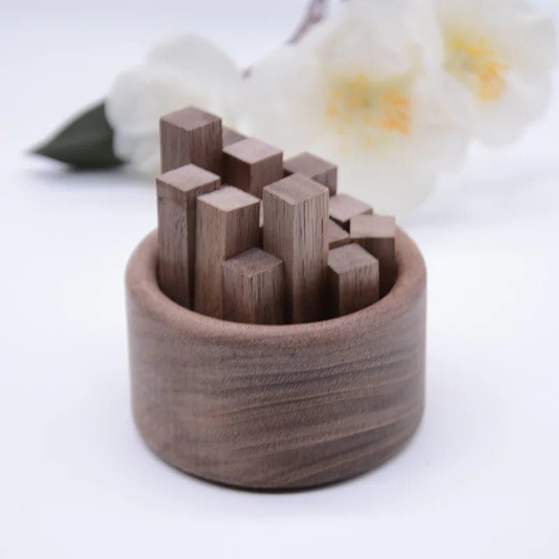 Wooden building blocks in a wooden container 