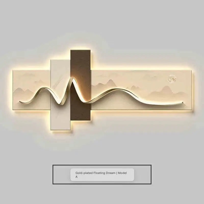 Modern wall light fixture with gold and silver design on a plain background