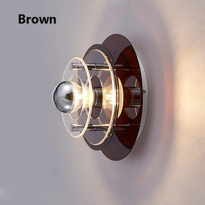 Wall-mounted light fixture with brown and gold design on a gray background