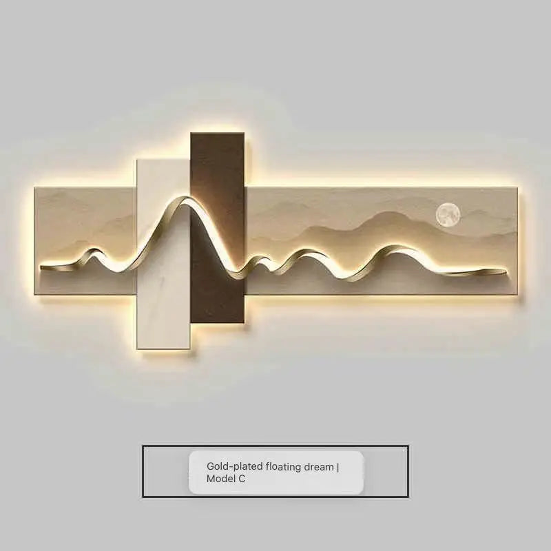 Modern wall light fixture with gold and bronze design on a white background