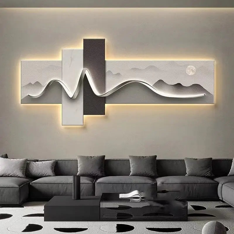 Modern living room with a gray sectional sofa and decorative wall art.