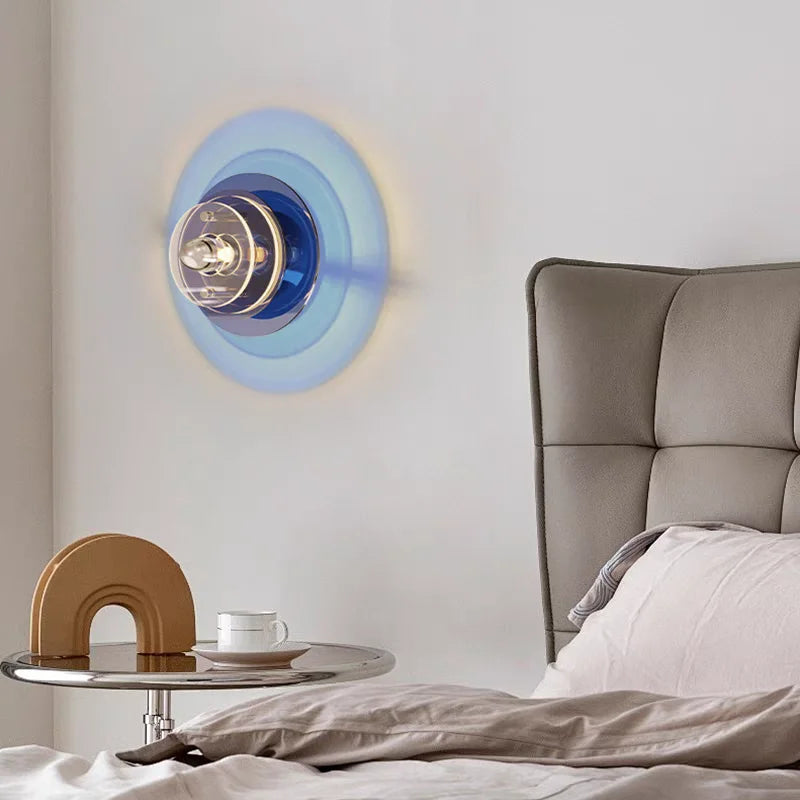 Modern bedroom with a decorative wall clock and side table.