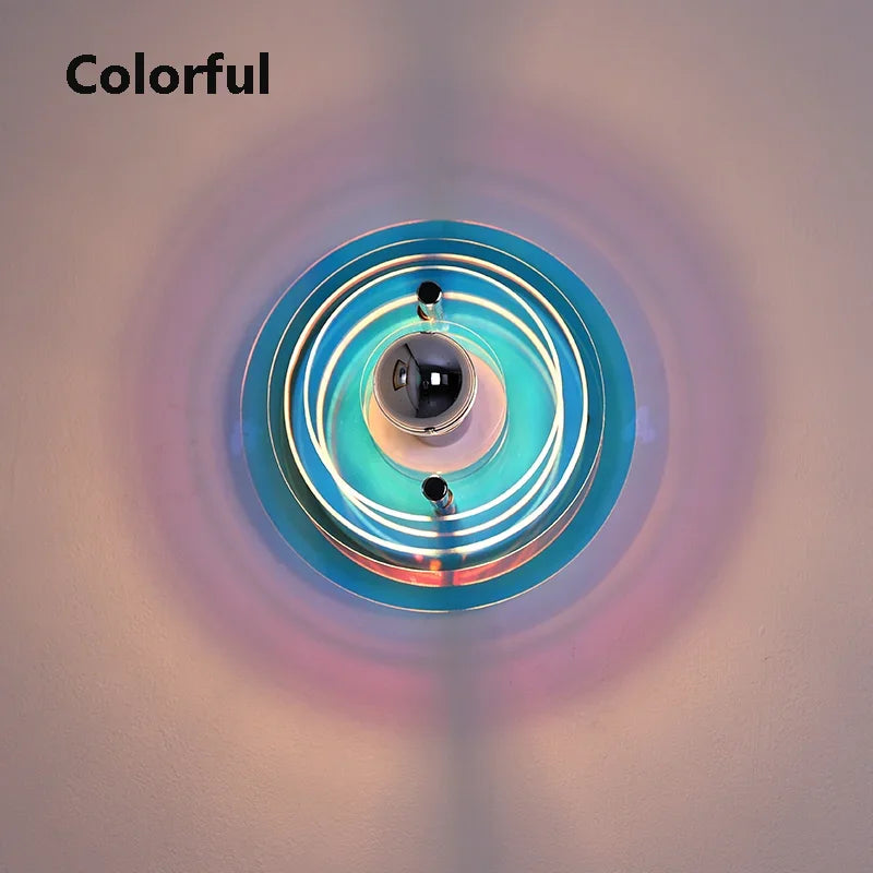 Ceiling light fixture with colorful circular design on a plain background